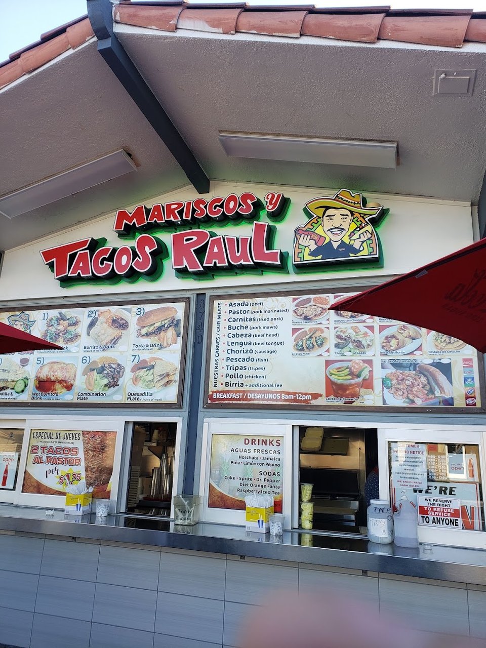 Breakfast dishes listed beside aguas frescas.